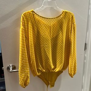 Yellow polka dot body suit
